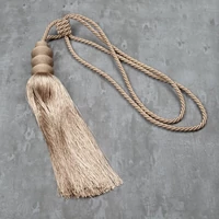 Kép 1/3 - daga-egy-bojtos-fuggonyelkoto-bezs-hs386849